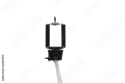 Selfie stick and smartphone on an isolated white background