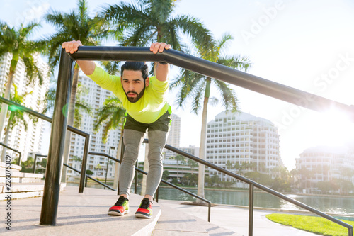 Young man stretching out at the streets of Miami