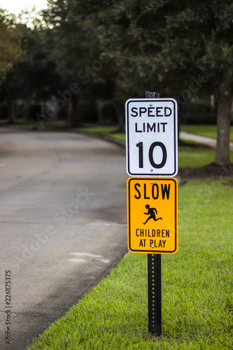 speed limit and slow children sign