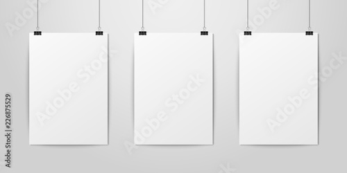Three Vector Realistic White Blank Vertical A4 Paper Poster Hanging on a Rope with Binder Clip Set on White Wall mock-up. Empty Poster Design Template for Mockup