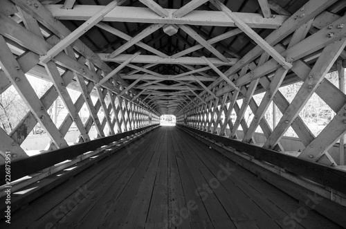 Fototapeta Naklejka Na Ścianę i Meble -  Black and white Lattice work detail on The Ashuelot Covered Bridge crosses the Ashuelot River and Bolton Road in Winchester New Hampshire