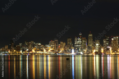 Colorful Seattle City scape at night reflected in water