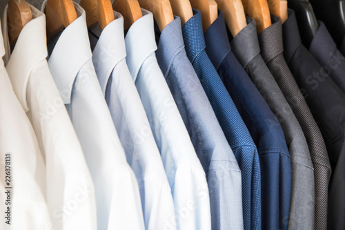 Fotografía Office Business shirts hanging in a closet ordered by colour