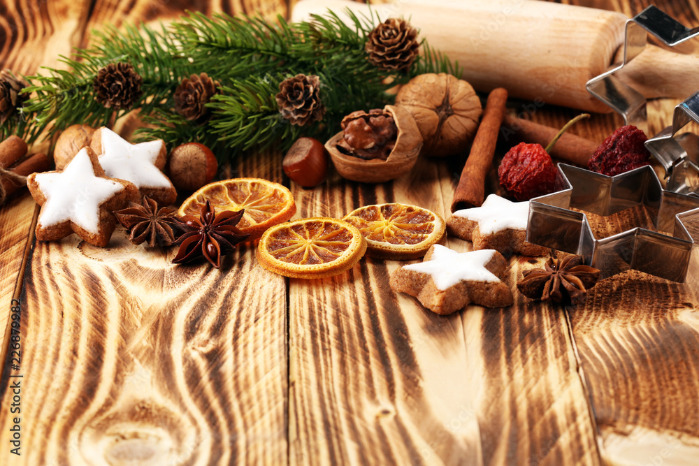 Baking christmas cookies. Typical cinnamon stars bakery with spices. xmas decoration Baking christmas cookies. Typical cinnamon stars bakery with spices. xmas decoration