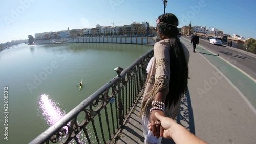 Holding hands on Puente de Isabel II bridge, POV