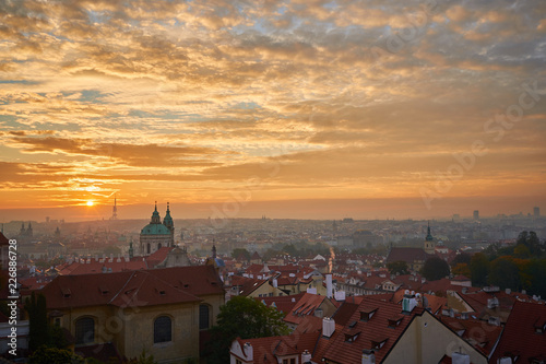 Schilderij op canvas Landcape or cityscape view on old town of Prague and Lesser town during the golden hour in sunrise with beautiful clouds and sun light taken from hill of prague castle