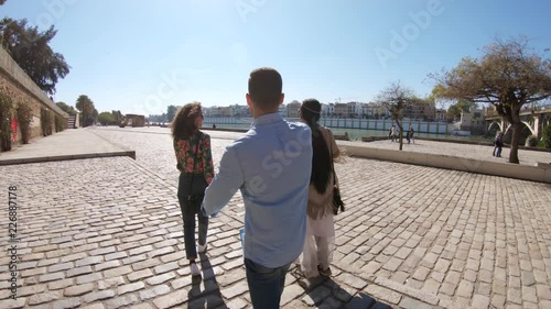 Tourists approach Puente de Isabel II, POV