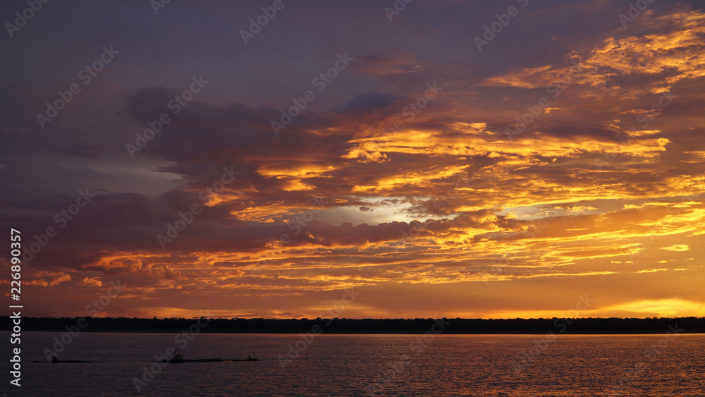 Fototapeta premium Sunset over the Amazonas River near Mocagua, Colombia