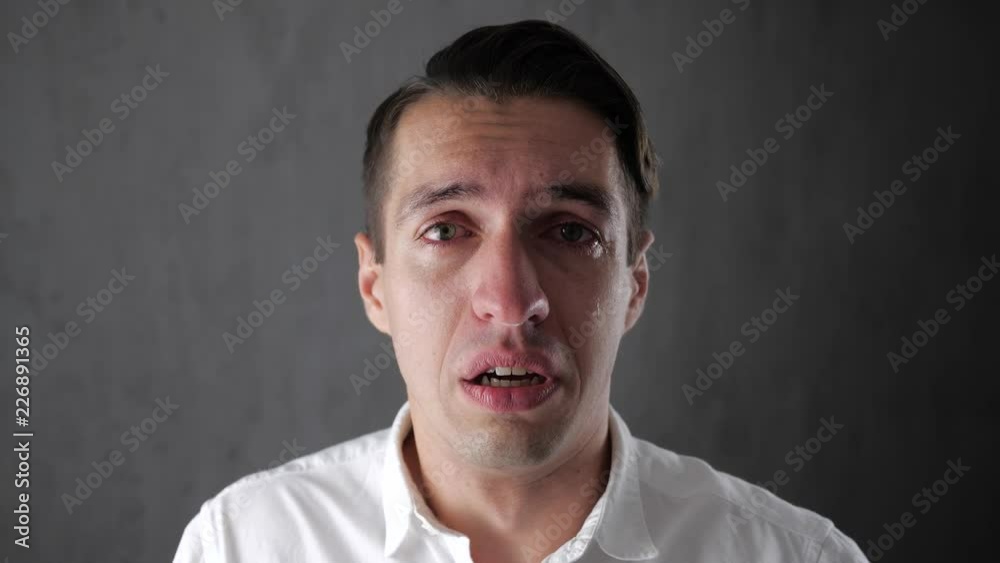 Portrait of sad man crying with tears in eyes. Depressed businessman crying. Man in despair. Portrait of sad man crying with tears in eyes. Depressed businessman crying. Man in despair.