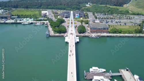 Aerial shot of Tamsui Lovers bridge along with Taipei's city scape and mountainscape photo