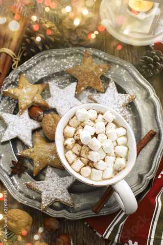 Hot chocolates with marshmallows and Christmas cookies