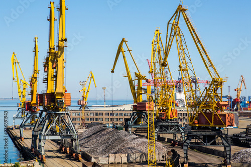 Industrial landscape port terminal general cargo. Port terminal for transshipment of steel, iron ingots, steel pipes and sheet steel