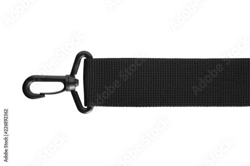 Black belt rope strap lanyard, hanging plastic clasp snap latch hook carabiner, isolated macro closeup, horizontal