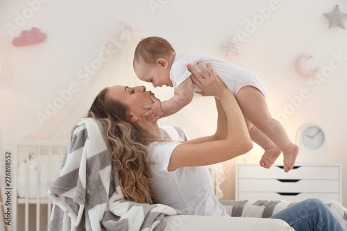 Young mother with her cute ...