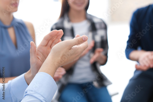 People clapping at group therapy session