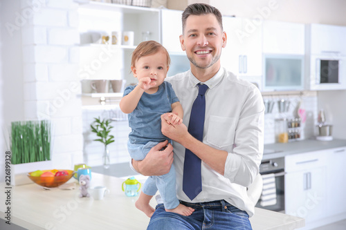 Father with his cute little...
