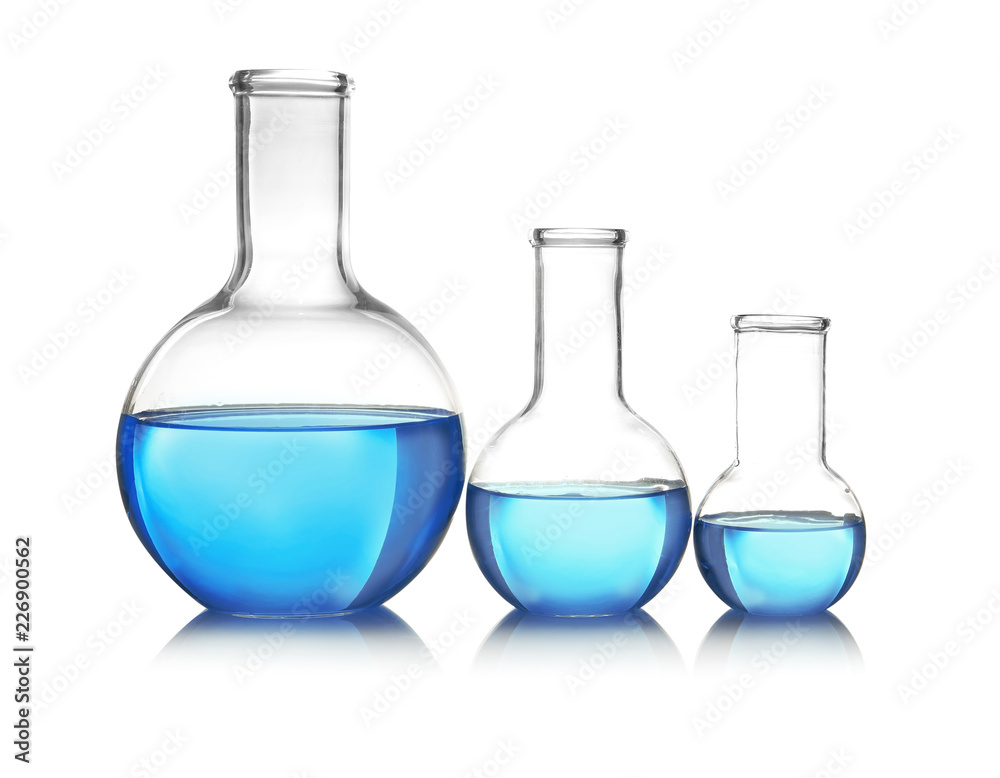 Flasks with blue liquid on table against white background. Laboratory analysis Flasks with blue liquid on table against white background. Laboratory analysis