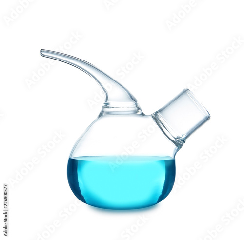 Retort flask with blue liquid on table against white background. Laboratory analysis
