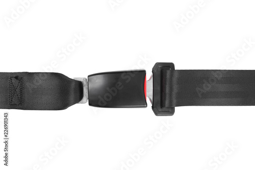 Fastened car safety seat belt on white background, top view