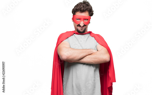 Young bearded super hero looking angry, unhappy and frustrated, gesturing furiously, with arms crossed, feeling upset and annoyed. photo