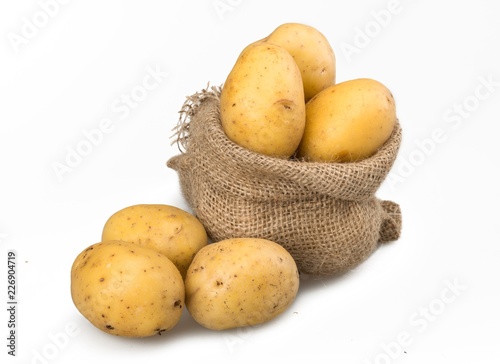 Yukon gold potatoes in burlap bag