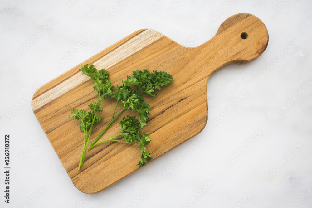 Parsley Sprigs on a Cutting Board
