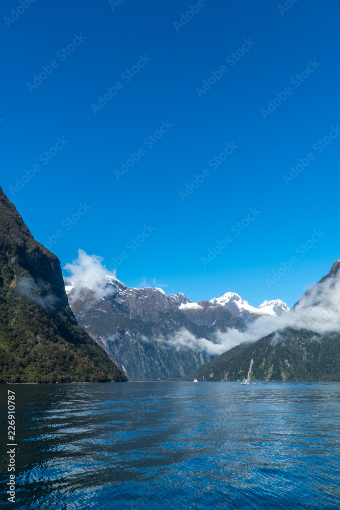 Portrait orientation of water and mountains in Milford Sound, Fiordland