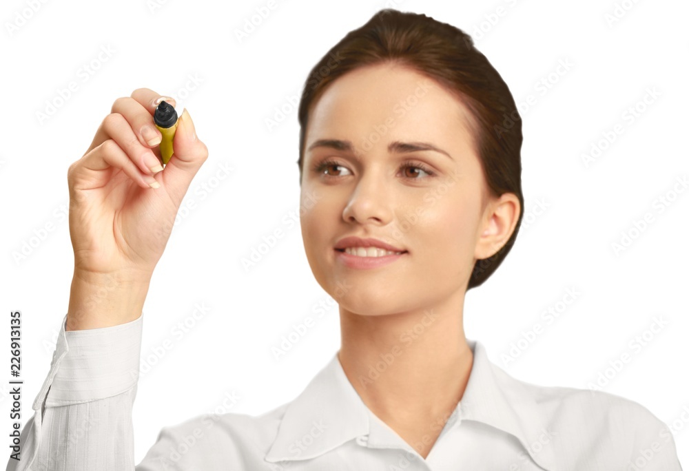 Professionally dressed female writing with a dry erase marker Professionally dressed female writing with a dry erase marker