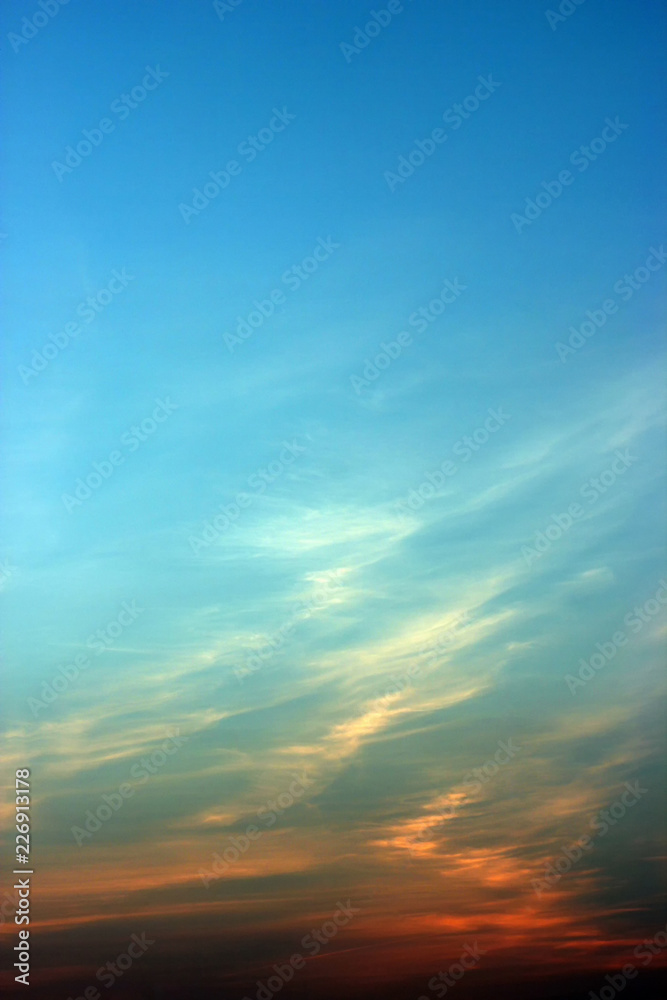 A huge blue sky with tiny clouds. use as background or wallpaper