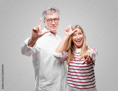 senior cool husband and wife gesturing 