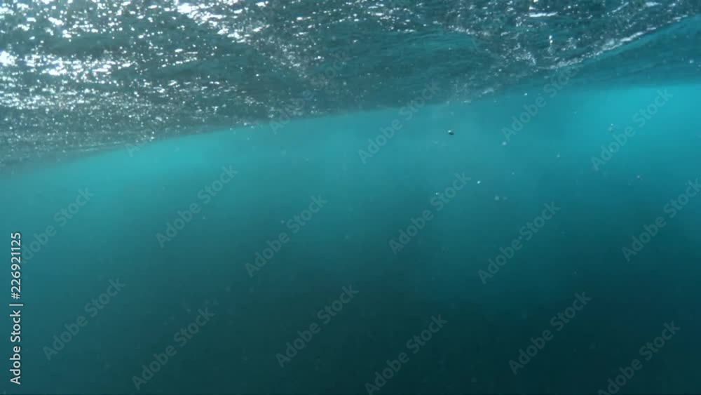 Scenic waves breaks, underwater close up