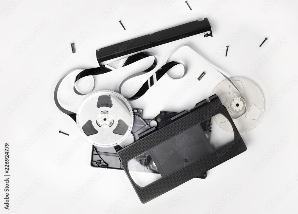 Video Cassette tape or VHS video cartridge exploded in to parts