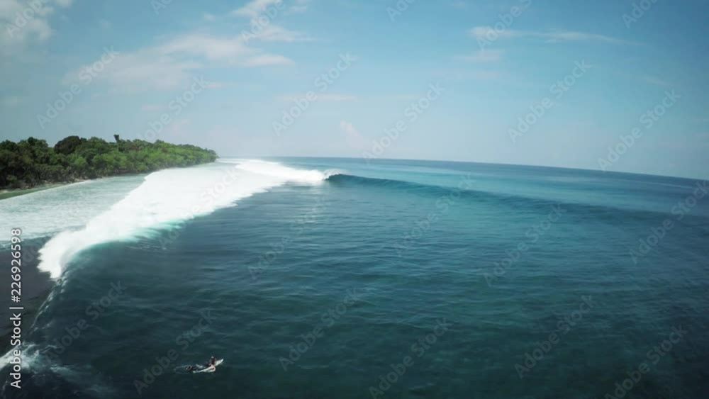 Wide aerial, surfers near Mentawai Island