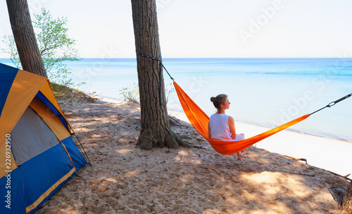 Woman on beach in hammock 