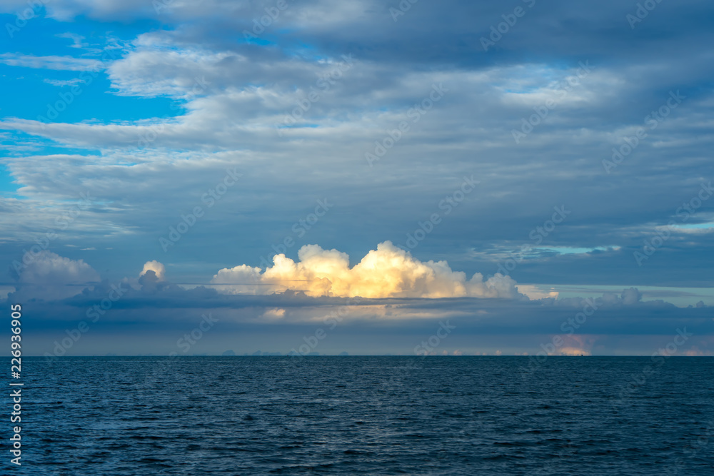 The clouds with sunlight above the sea.