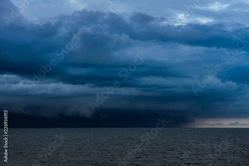 Seascape with rain clouds.