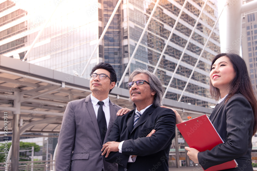 Asian business team work look forward to the future of Success team. Asian business team work look forward to the future of Success team.