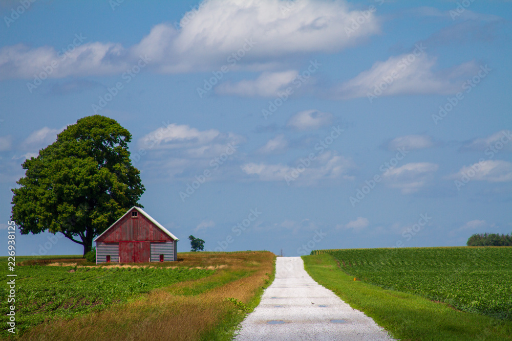 Lonely barn on rocky road Lonely barn on rocky road