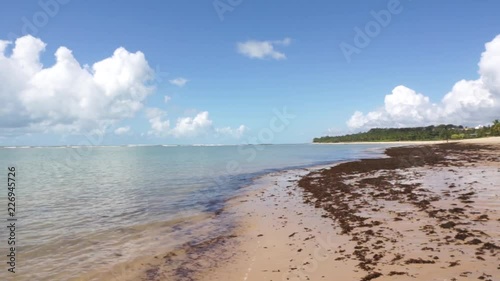 Tropical beach sunny day in Arraial D'Ajuda Bahia Brazil: Low tide pan RL photo