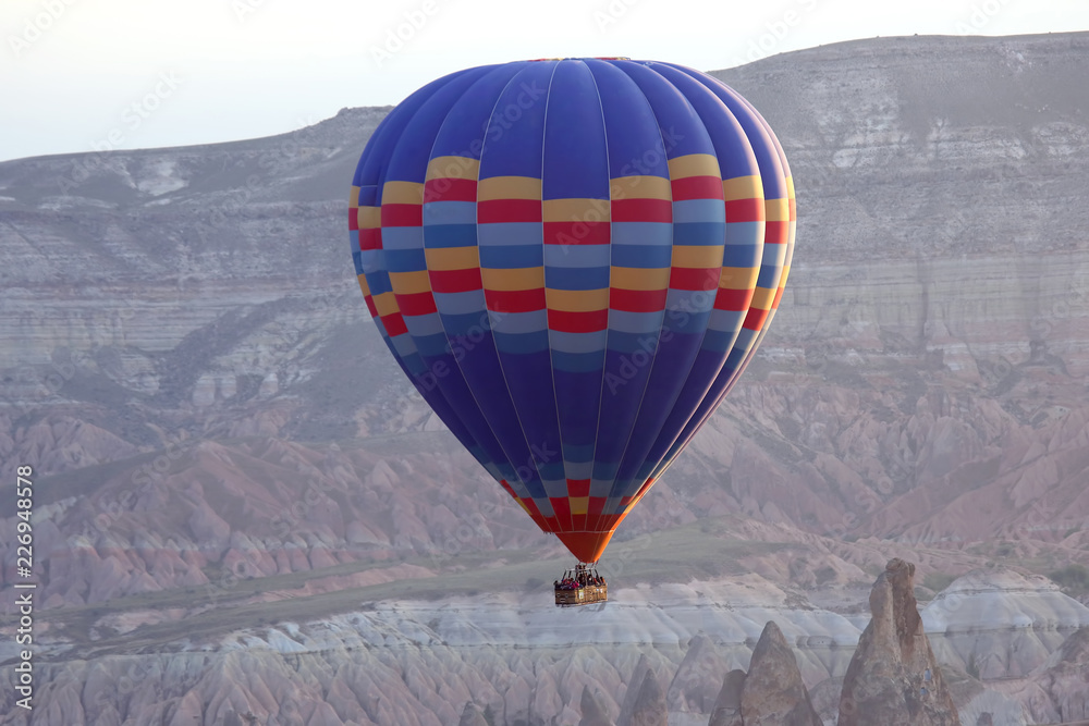 Obraz premium balloon is flying in mountainous area in Cappadocia. Turkey