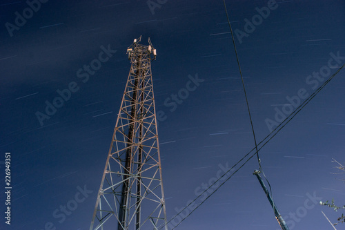 high voltage tower on background of blue sky