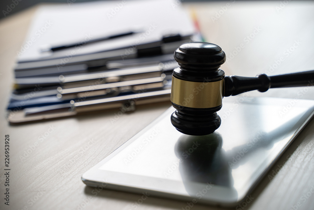 Judge and documents on office desk Legislation Judge and documents on office desk Legislation