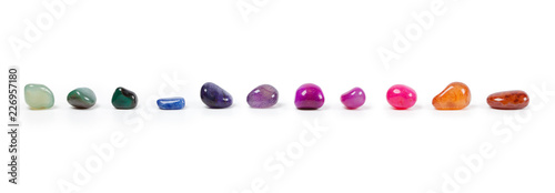 Photos Colorful natural gem stones alighed and Isolated on white
