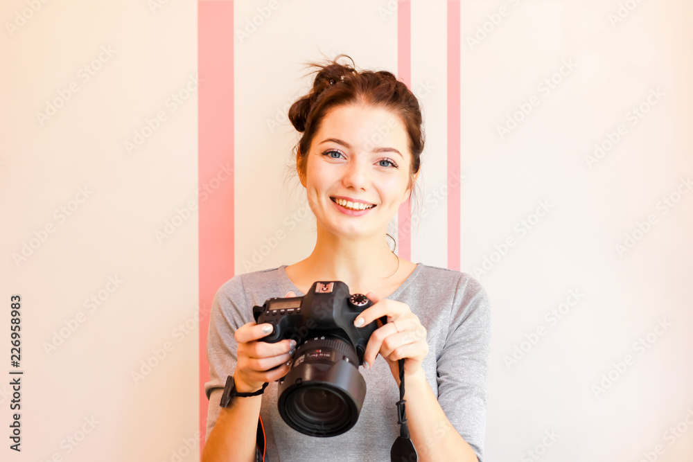 Portrait of Girl photographer smiling and holding her camera Portrait of Girl photographer smiling and holding her camera