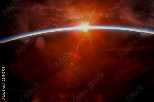 Earth with eclipse on starry sky. Abstract space sunrise . Elements of this image furnished by NASA.