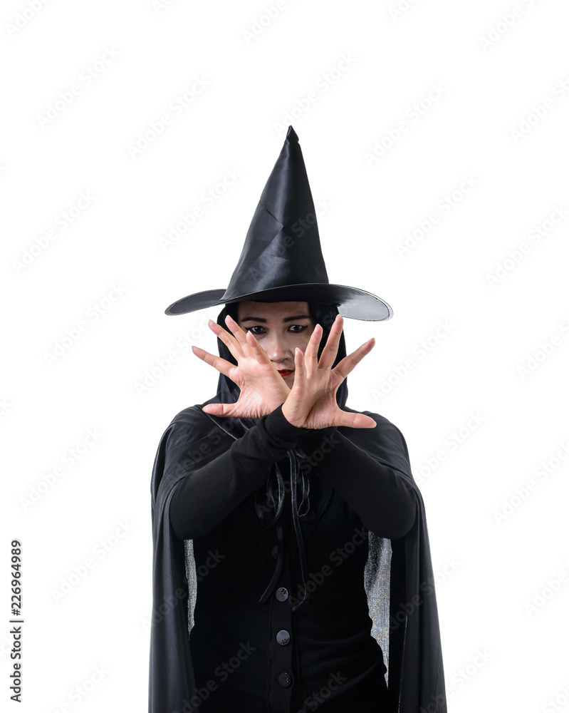 Portrait of woman in black Scary witch halloween costume standing with hat isolated on white background Portrait of woman in black Scary witch halloween costume standing with hat isolated on white background