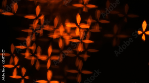 Blurred view of beautiful lights on dark background