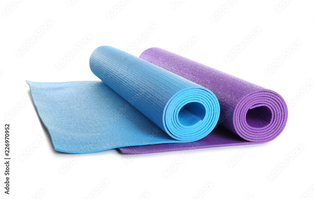 Different yoga mats on white background Different yoga mats on white background
