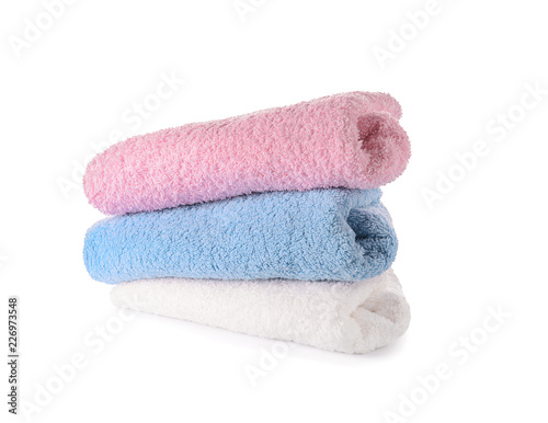 Clean rolled towels on white background