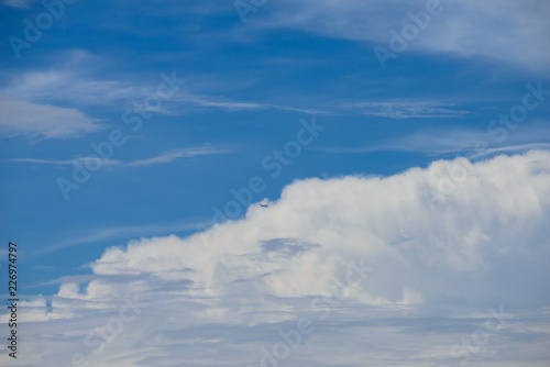 Rain clouds forming with blue sky background © joesayhello